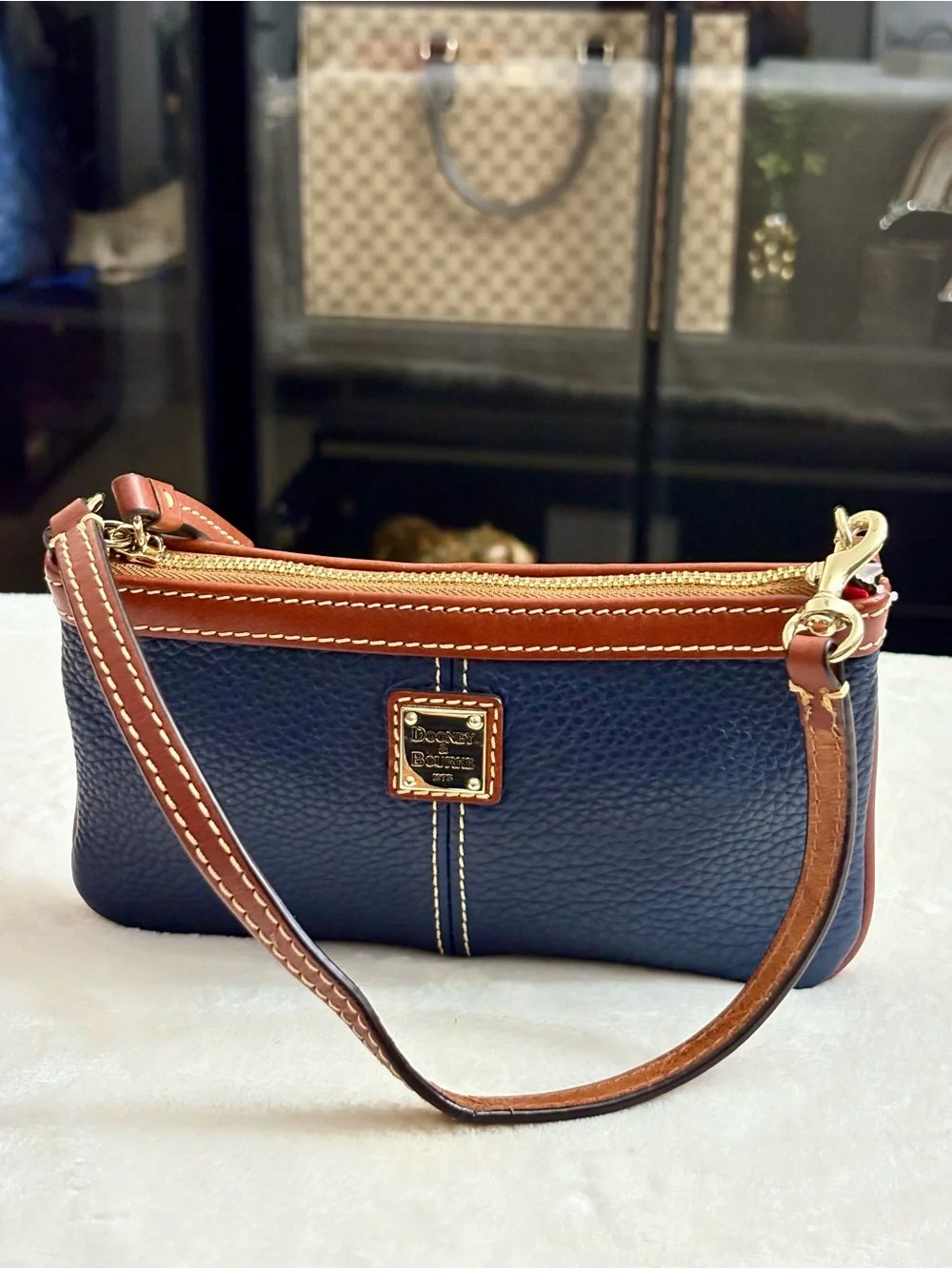 Dooney & Bourke Large Slim Cell Phone Wristlet – Navy Blue Pebble Grain Leather.